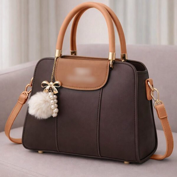 Elegant Dual Tone Handbag With Pom Pom Charm