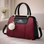 Elegant Dual Tone Handbag With Pom Pom Charm