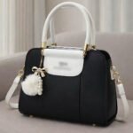 Elegant Dual Tone Handbag With Pom Pom Charm