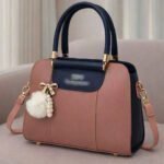 Elegant Dual Tone Handbag With Pom Pom Charm